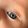 child, eye, close_up, iris, eyelashes, skin, face, natural_light, macro, portrait, human, detail, blue_eye, eyelid, eyebrow, reflection, pupil, soft_light, texture, innocence