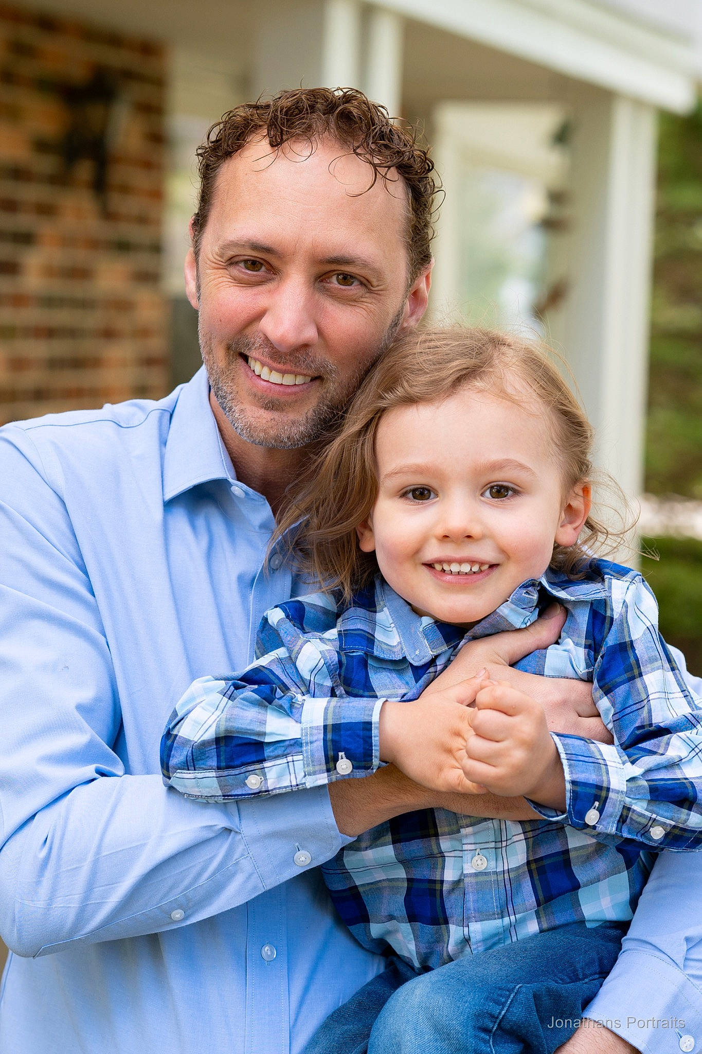 Phoenix is registered to the contest to win money with this photo: child, family, family_taking_photos_together, finger, fun, gesture, grass, happy, holding_hands, hug, interaction, joy, people, person, photograph, photography, plaid, plant, sitting, smile