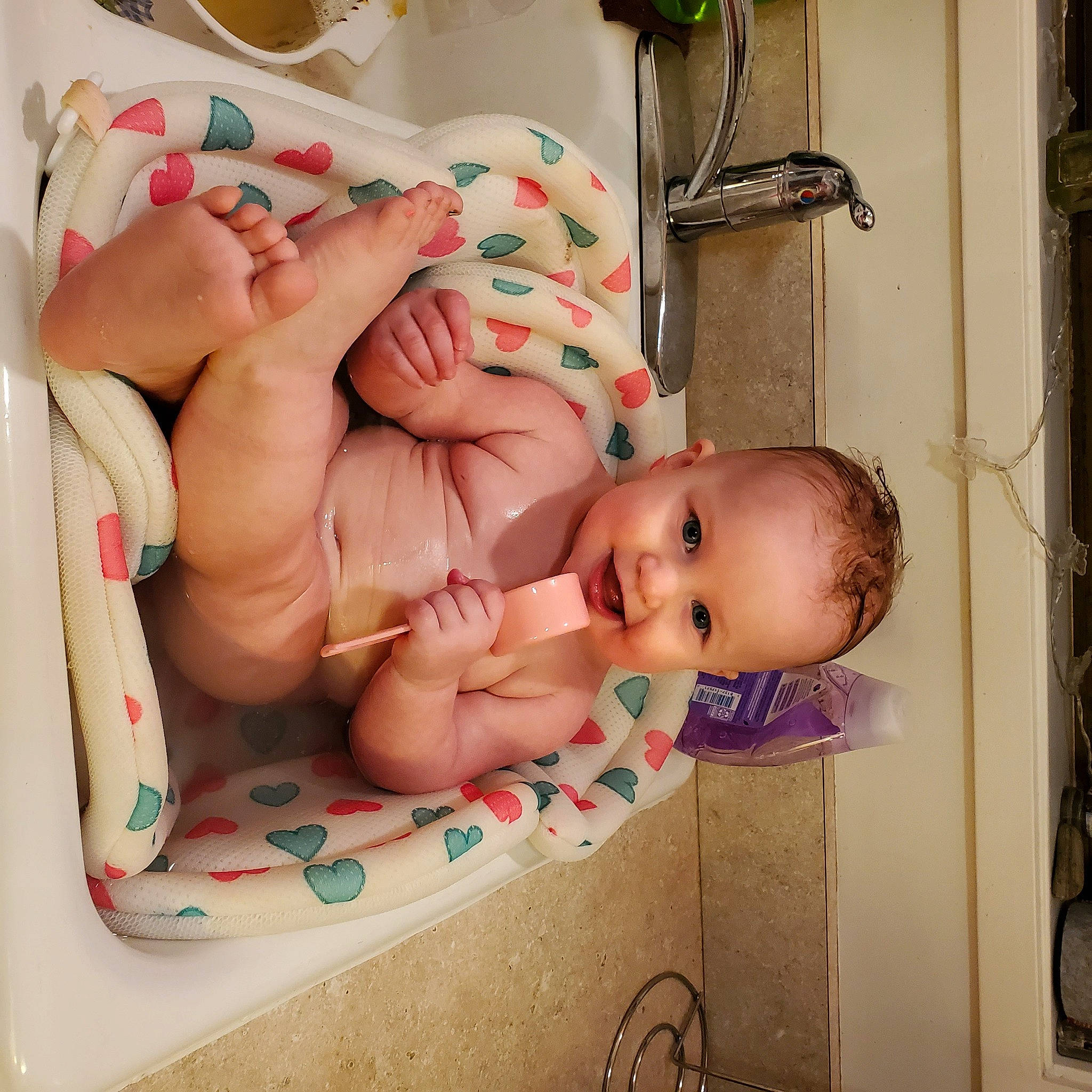 Madi is registered to the contest to win money with this photo: baby, baby_products, baby_safety, baby_toddler_clothing, child, cutlery, diaper, foot, human_body, joy, kitchen_utensil, person, toddler, toe