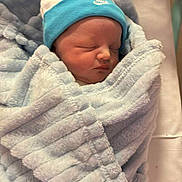 Jaxon joined the competition — help win amazing prizes! newborn, baby, blanket, hat, sleeping, infant, hospital, crib, soft, blue, wrapped, cute, peaceful, face, resting, clothing, bed, person, portrait, toddler