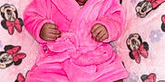 Soular joined the competition — help win amazing prizes! baby, infant, pink_robe, blanket, minnie_mouse, pattern, child, cute, sleepwear, soft_texture, feet, hands, portrait, lying_down, indoor, adorable, face, expression, hood, resting