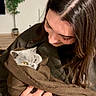 Urus a rejoint le concours — aidez-le/la à gagner de superbes lots ! woman, cat, gray_cat, pet, indoor, portrait, cozy, blanket, wrapped, cuddling, affection, long_hair, brown_hair, face, eyes, golden_eyes, hand, plant, home, photography