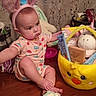 Oaklynn joined the competition — help win amazing prizes! baby, bunny_ears, child, clothing, curtains, cute, expression, face, headwear, indoors, person, pink, playtime, sitting, snack, soft_toy, stuffed_animal, toy_basket, wooden_floor, yellow