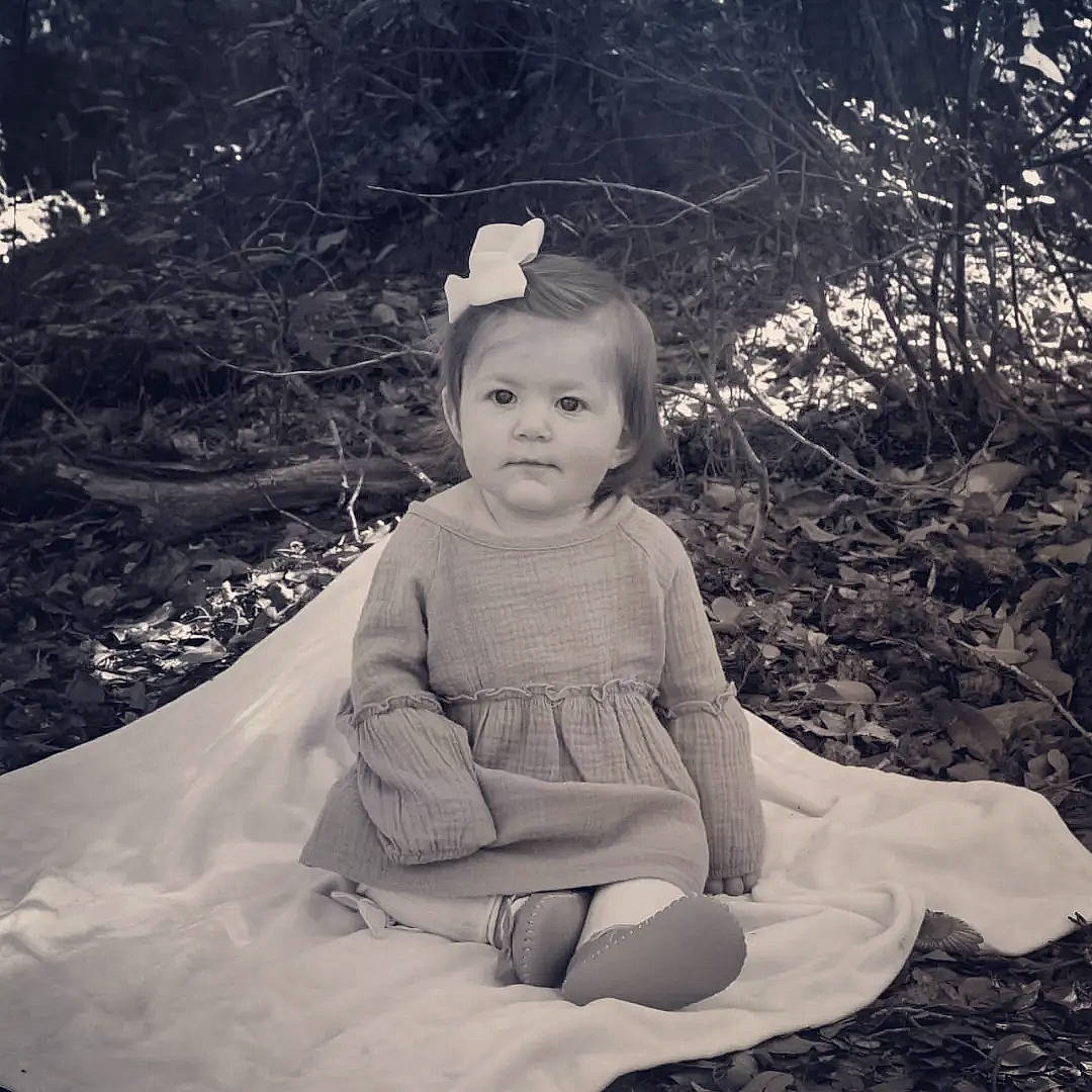 Lindley joined the competition — help win amazing prizes! baby, black_and_white, child, dress, eye, flash_photography, grass, happy, head, headpiece, monochrome, monochrome_photography, people_in_nature, person, sitting, sleeve, stock_photography, style, tints_and_shades, toddler