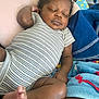 baby, sleeping, onesie, striped_clothing, pillow, duck_design, blanket, cozy, infant, cute, peaceful, relaxing, child, indoors, skin, foot, hand, nap, soft, resting