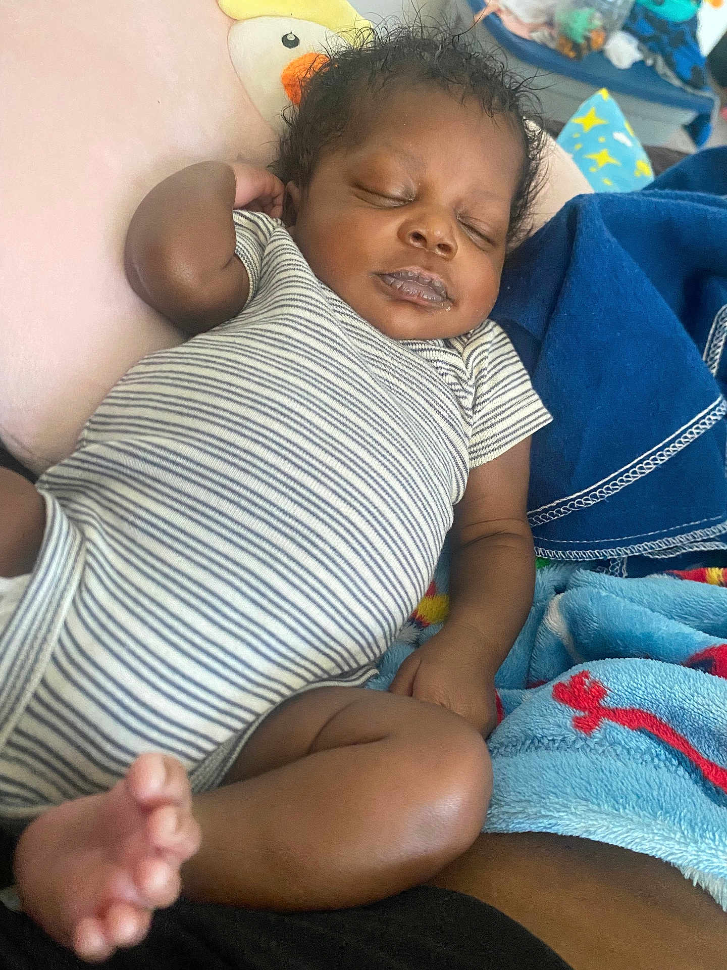 Rayquan joined the competition — help win amazing prizes! baby, sleeping, onesie, striped_clothing, pillow, duck_design, blanket, cozy, infant, cute, peaceful, relaxing, child, indoors, skin, foot, hand, nap, soft, resting