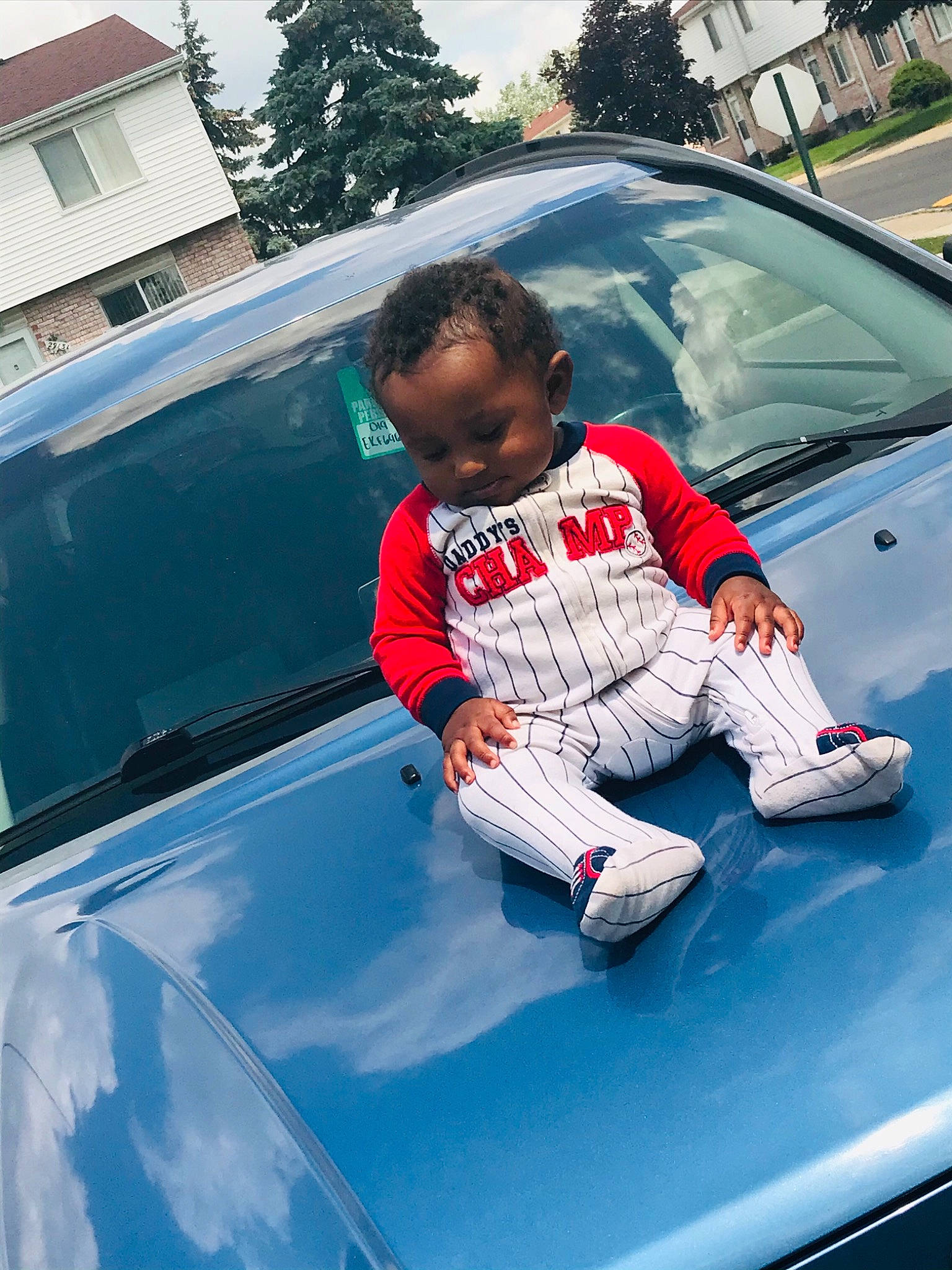 Kasen is registered to the contest to win money with this photo: auto_part, automotive_design, automotive_exterior, automotive_lighting, automotive_tire, bumper, car, fender, glass, grille, hood, motor_vehicle, person, sky, t_shirt, tints_and_shades, trunk, vehicle, vehicle_door, window