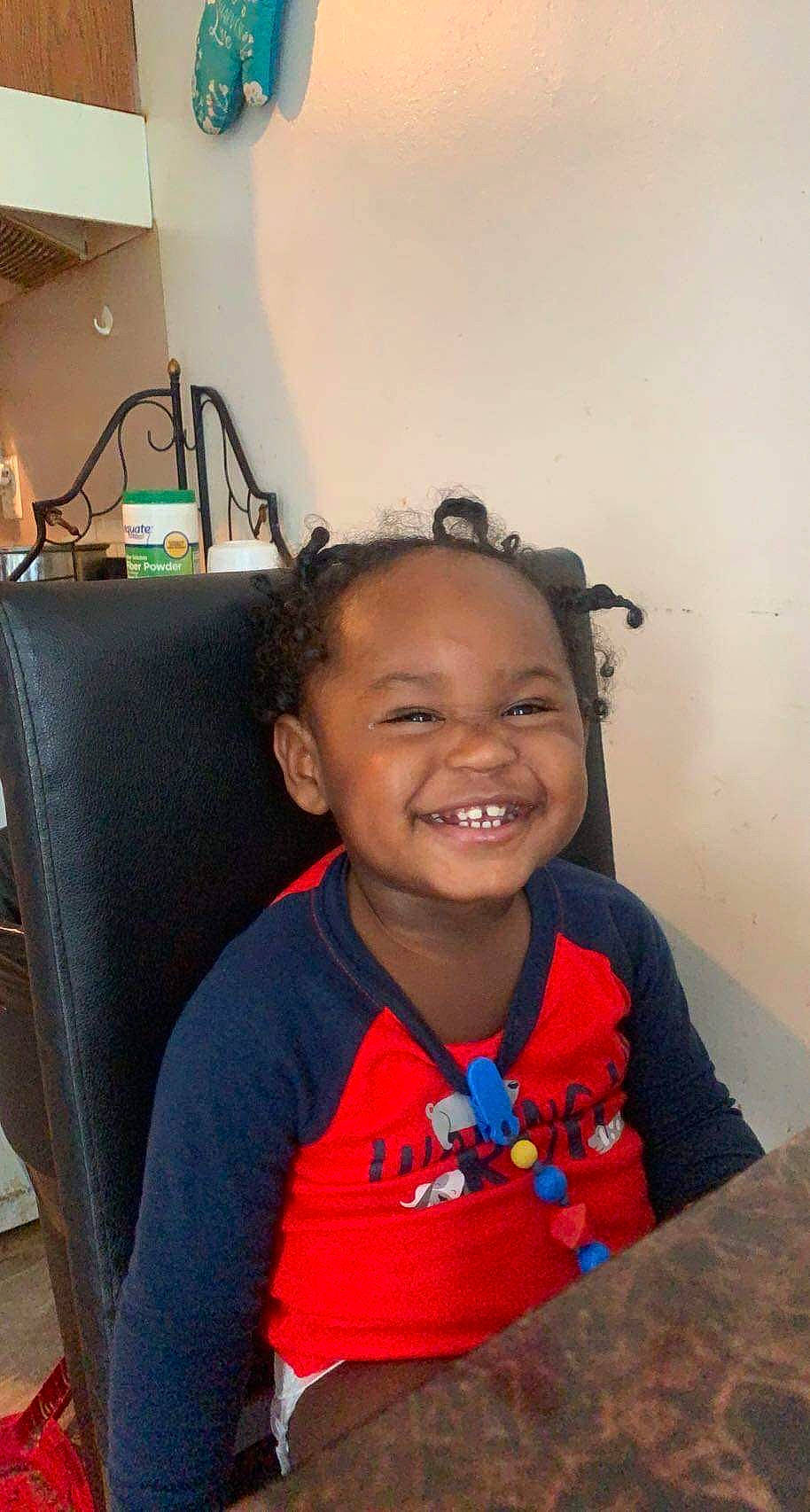 Mark is registered to the contest to win money with this photo: audio_equipment, black_hair, chair, cheek, child, ear, flooring, forehead, fun, hairstyle, happy, joy, laugh, neck, person, room, sitting, skin, smile, t_shirt