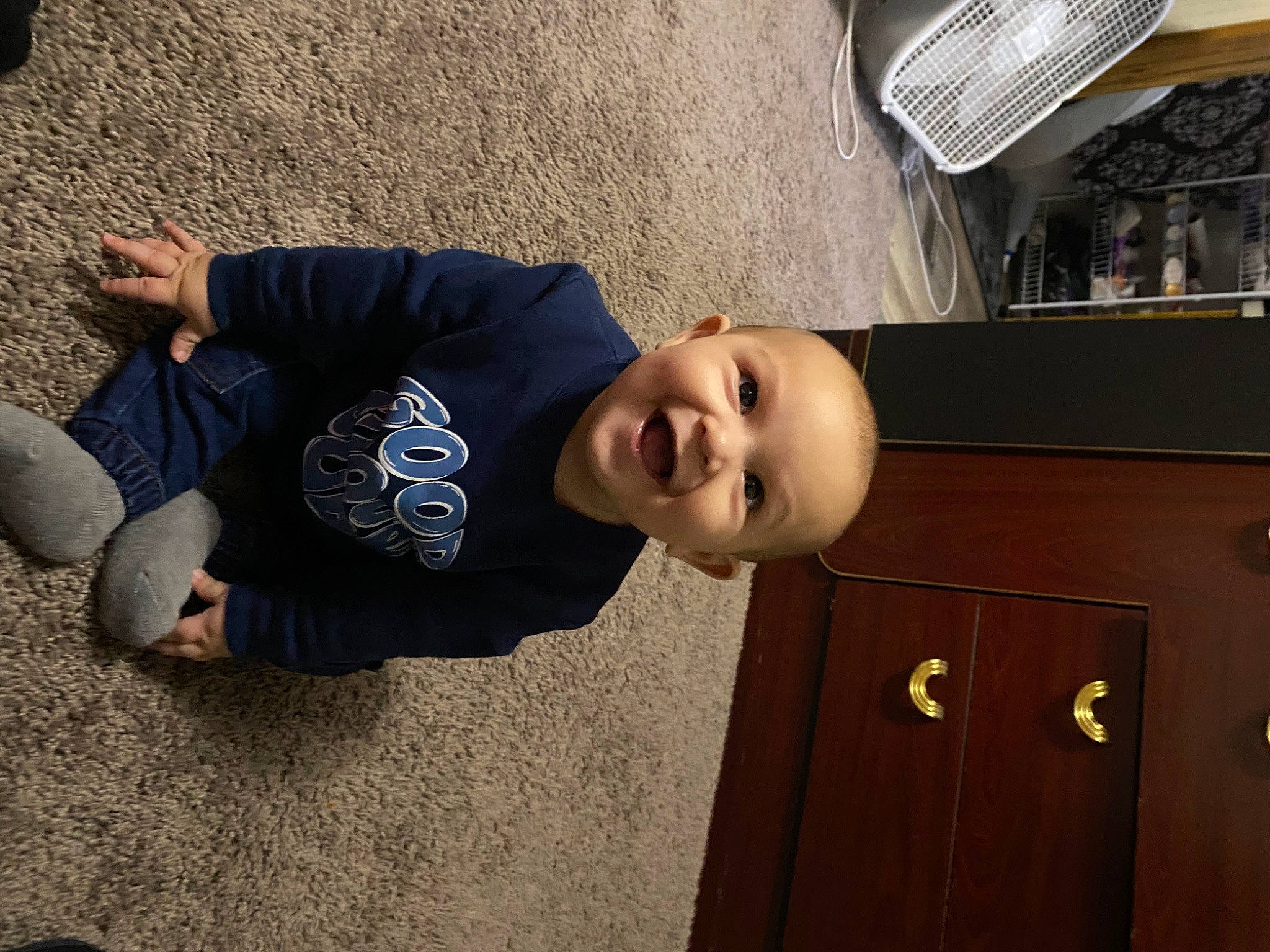 Kylan is registered to the contest to win money with this photo: asphalt, automotive_design, automotive_exterior, automotive_lighting, automotive_tire, bumper, cabinetry, concrete, denim, drawer, fun, hat, motor_vehicle, person, road_surface, smile, t_shirt, toddler, tree, vehicle_door