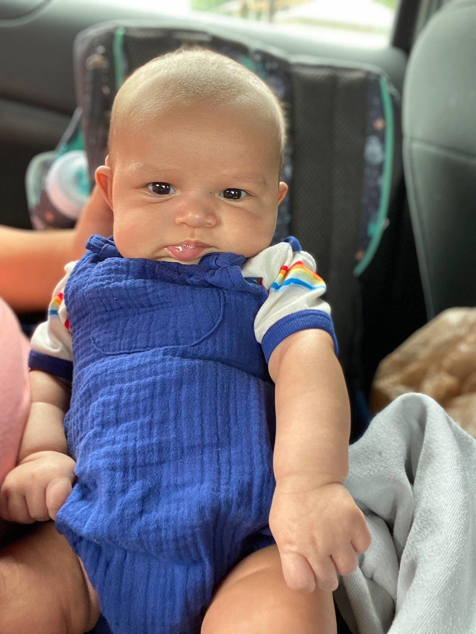 Kylan is registered to the contest to win money with this photo: auto_part, baby, baby_toddler_clothing, car_seat, car_seat_cover, cheek, child, chin, comfort, electric_blue, eye, finger, happy, head_restraint, lap, nail, person, skin, smile, thumb