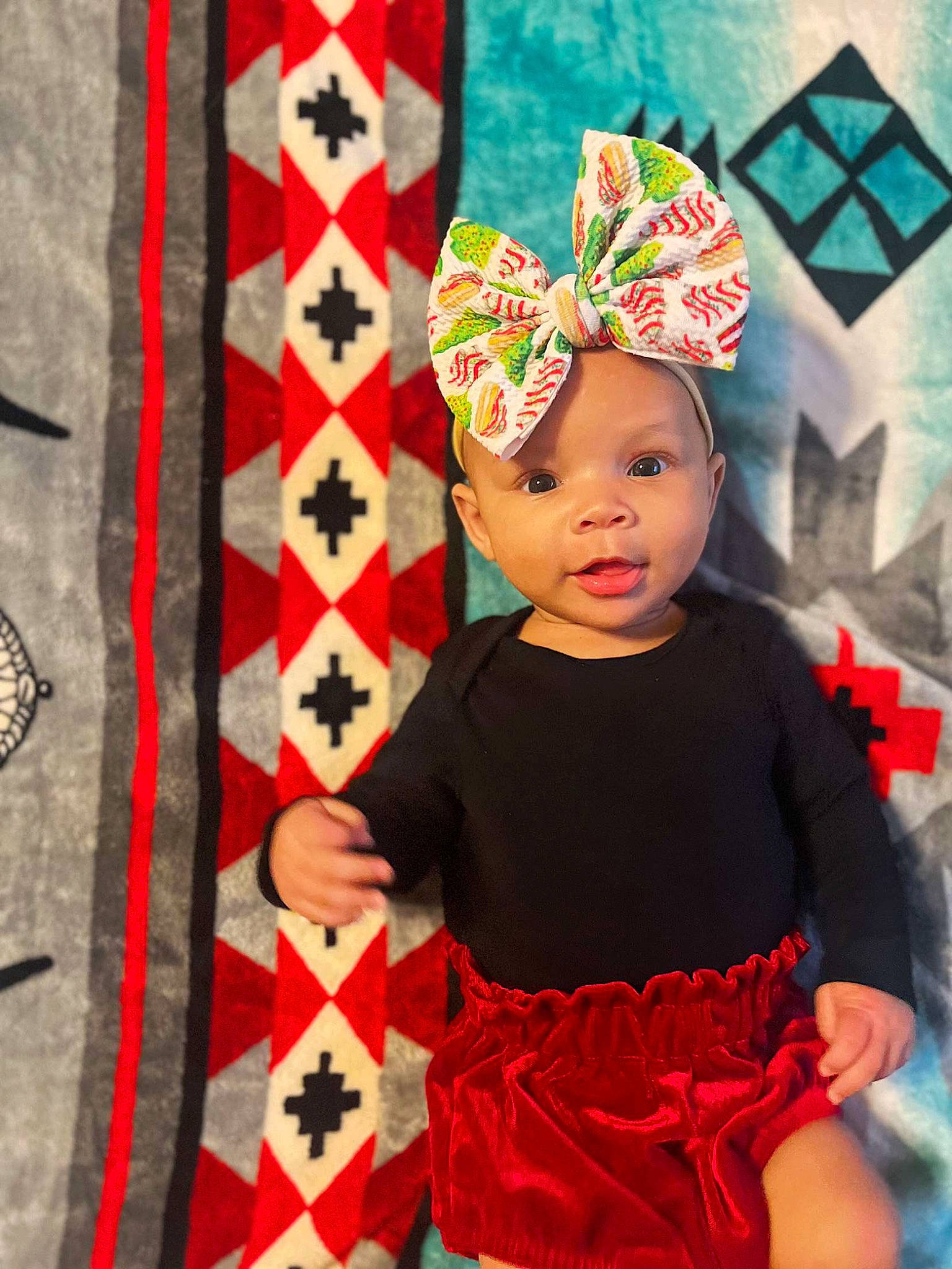 Emersyn joined the competition — help win amazing prizes! baby_toddler_clothing, child, clothing, costume_hat, entertainment, event, face, happy, hat, head, headgear, headpiece, headwear, magenta, party_supply, pattern, person, pink, red, sleeve
