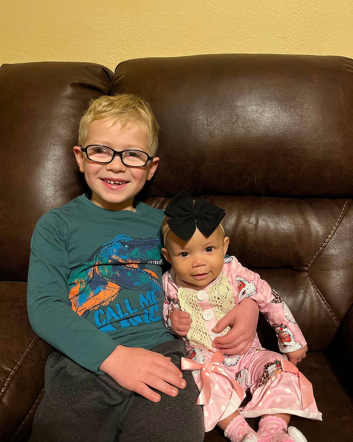 Rayge is registered to the contest to win money with this photo: baby_toddler_clothing, cheek, child, comfort, couch, eye, eyewear, facial_expression, flash_photography, fun, glasses, happy, head, headwear, joy, lap, person, shoulder, skin, sleeve