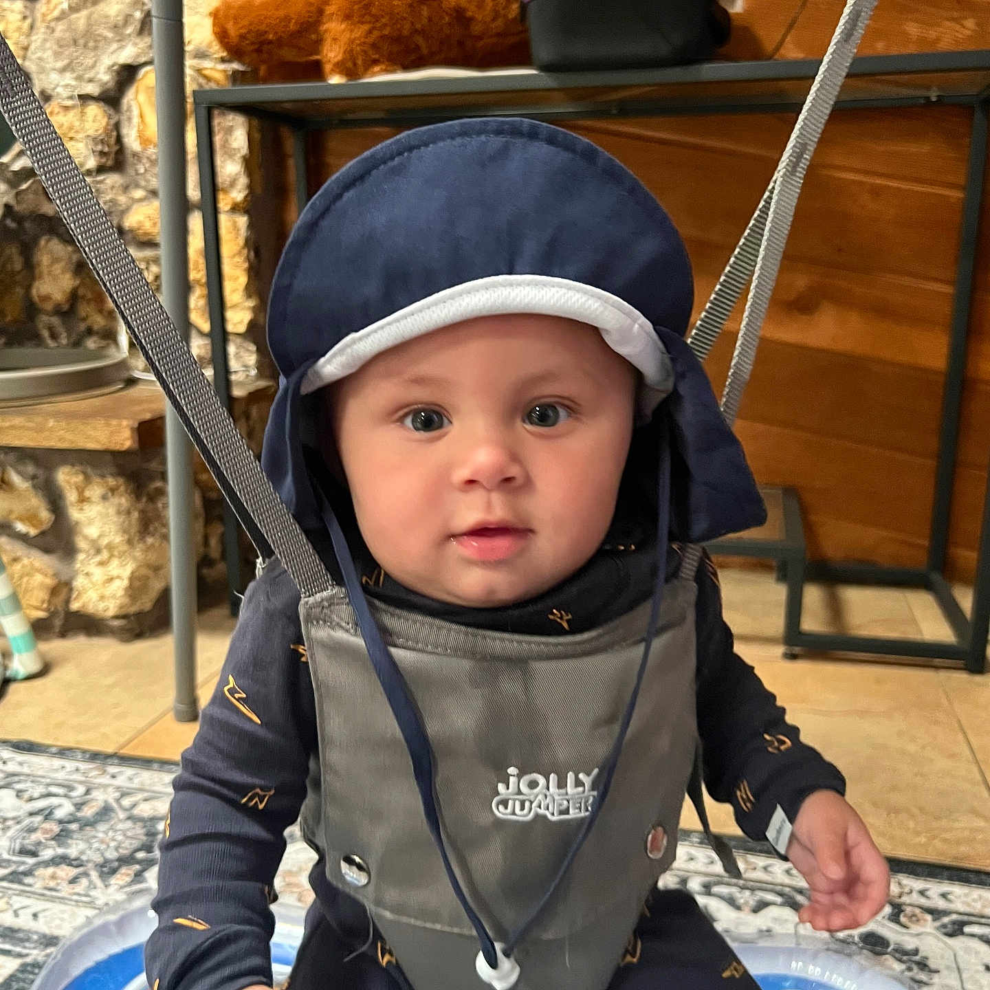 Levi is registered to the contest to win money with this photo: accessories, baby, bag, bonnet, cap, clothing, coat, face, handbag, hat, head, helmet, hood, jacket, pants, person, photography, portrait, sitting, toy