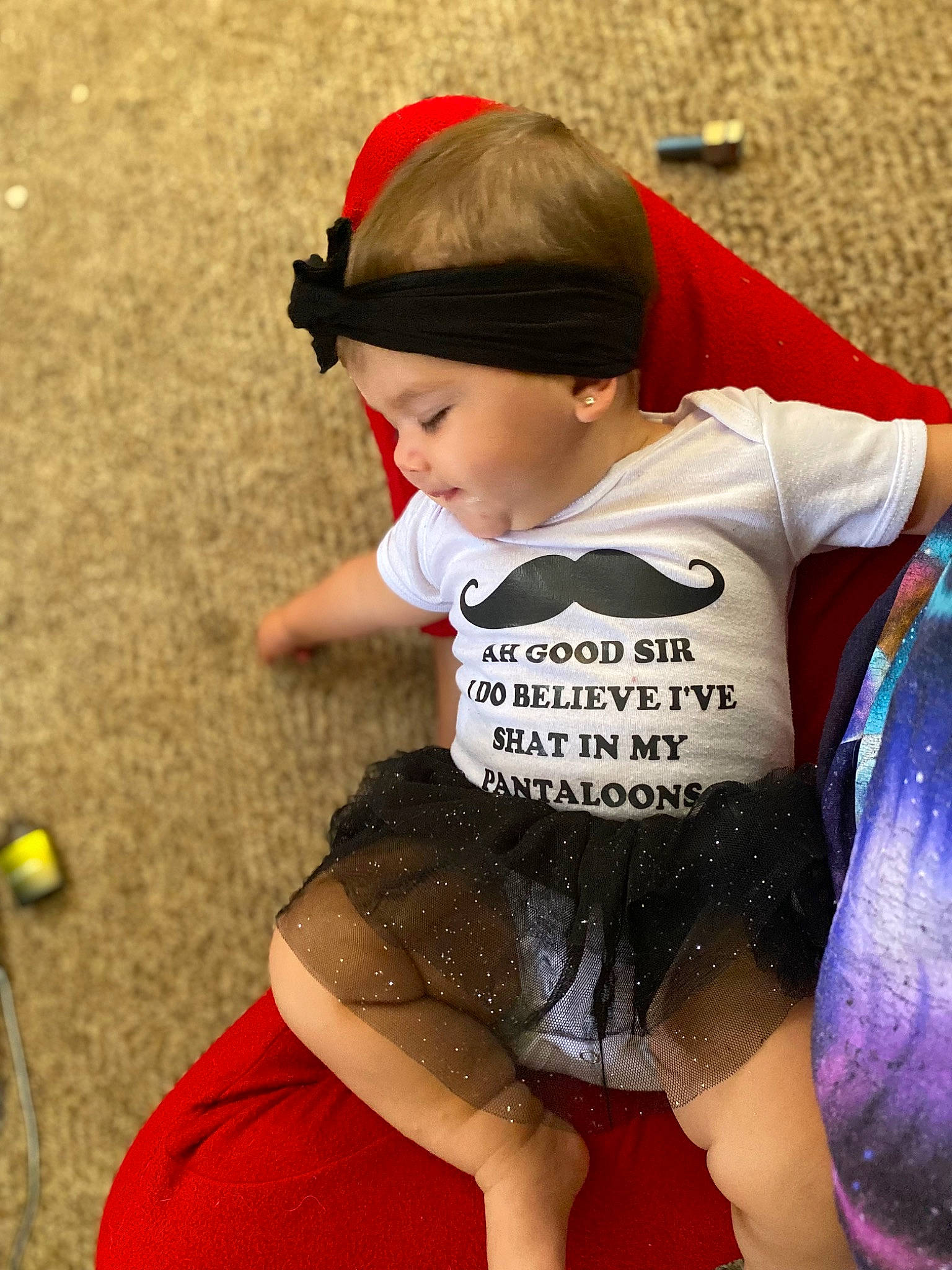 Emma is registered to the contest to win money with this photo: baby_toddler_clothing, child, cool, facial_expression, fun, hairstyle, happy, hat, headgear, headwear, person, personal_protective_equipment, product, recreation, sleeve, sportswear, summer, t_shirt, thigh, tire