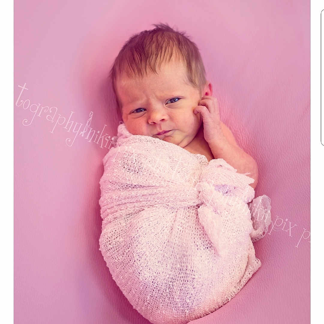 Emelia is registered to the contest to win money with this photo: baby, baby_products, baby_toddler_clothing, beige, cheek, child, fur, hand, head, person, photograph, photography, pink, portrait, portrait_photography, product, purple, skin, textile, toddler
