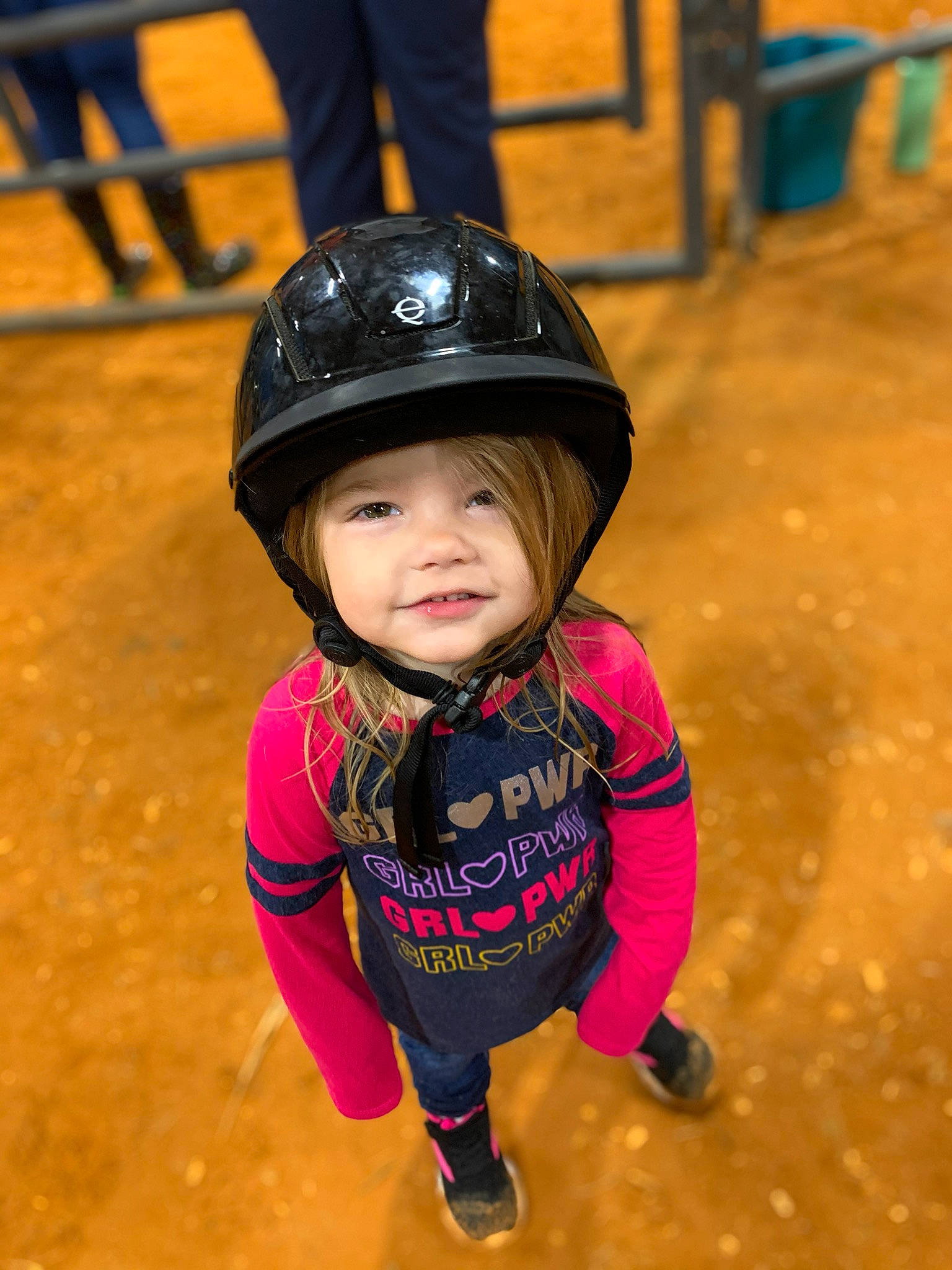 Shaylynn is registered to the contest to win money with this photo: bicycle_helmet, child, footwear, fun, headgear, headwear, helmet, person, personal_protective_equipment, play, smile, sports_equipment, sports_gear, toddler
