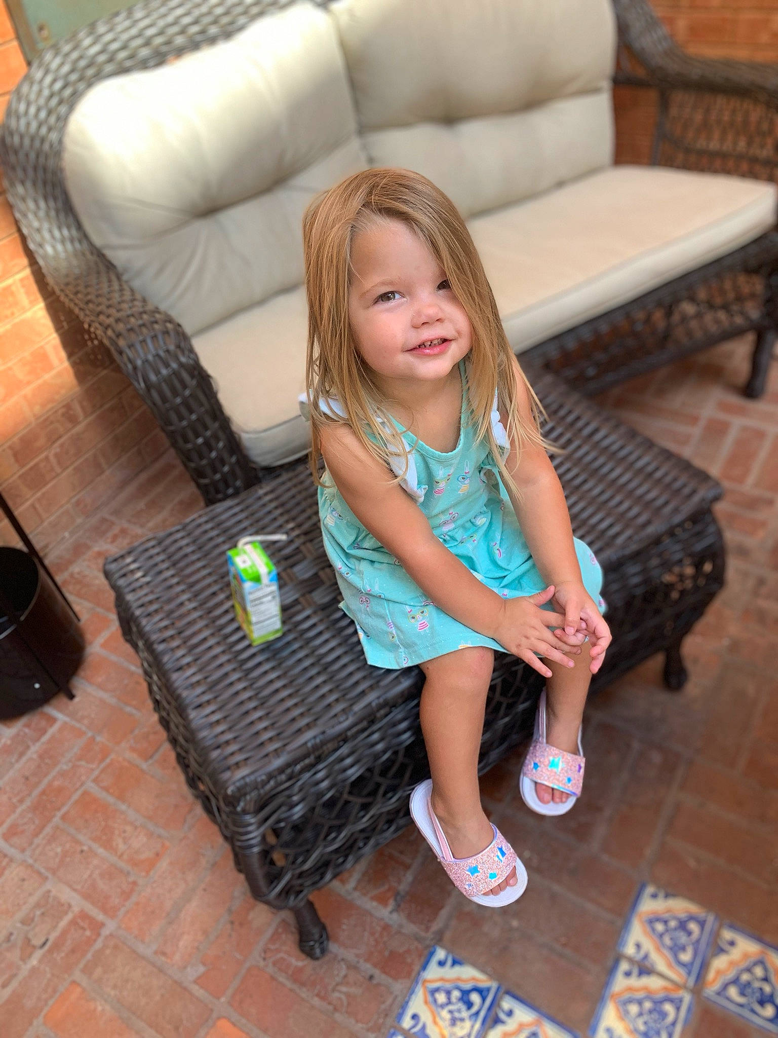Shaylynn is registered to the contest to win money with this photo: chair, child, flooring, furniture, leg, leisure, person, shoe, sitting, table, toddler, vacation
