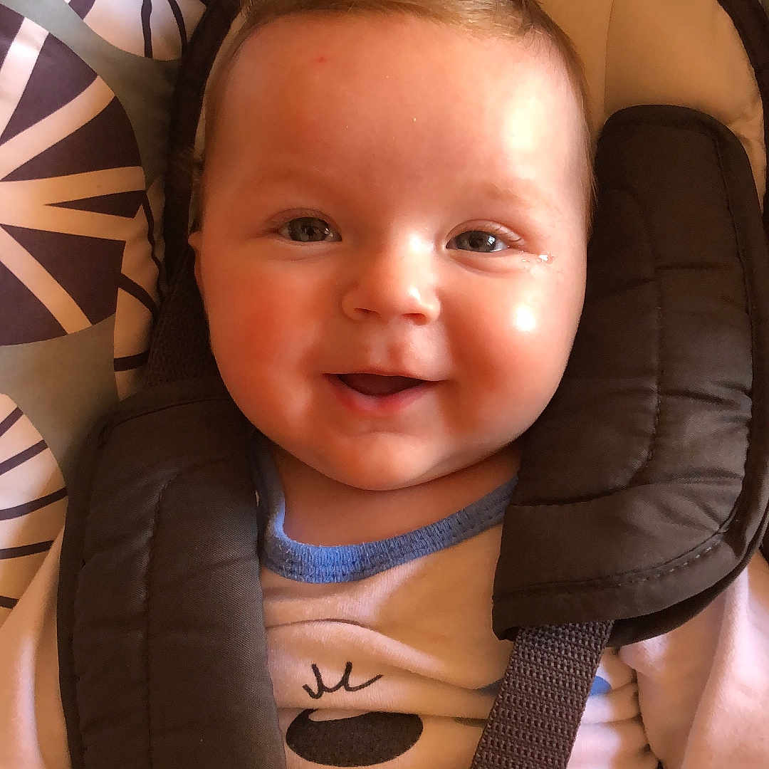 Brian Mirc participe au concours pour gagner de l'argent avec cette photo : baby, car_seat, child, clothing, comfort, cute, expression, fabric, face, happy, indoors, infant, patterned_background, portrait, safety, seat, seatbelt, smiling, straps, young_child