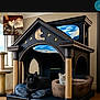 doghouse, animal, cat, pet, indoors, den, kennel, interiordesign, fireplace, couch, furniture, canine, dog, architecture, building, livingroom, room, playarea, tent, bed