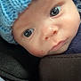 Arlo joined the competition — help win amazing prizes! baby, infant, face, blue_hat, knitted_hat, close_up, eyes, skin, cute, portrait, child, newborn, apparel, headwear, soft_lighting, car_seat, stroller, warm, indoors, baby_clothing