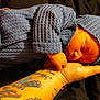 baby, infant, sleeping, blue_clothing, knitted_hat, knitted_outfit, tattoo, arm, hand, peaceful, resting, indoor, blanket, cuddly, cute, newborn, soft, portrait, child, cozy