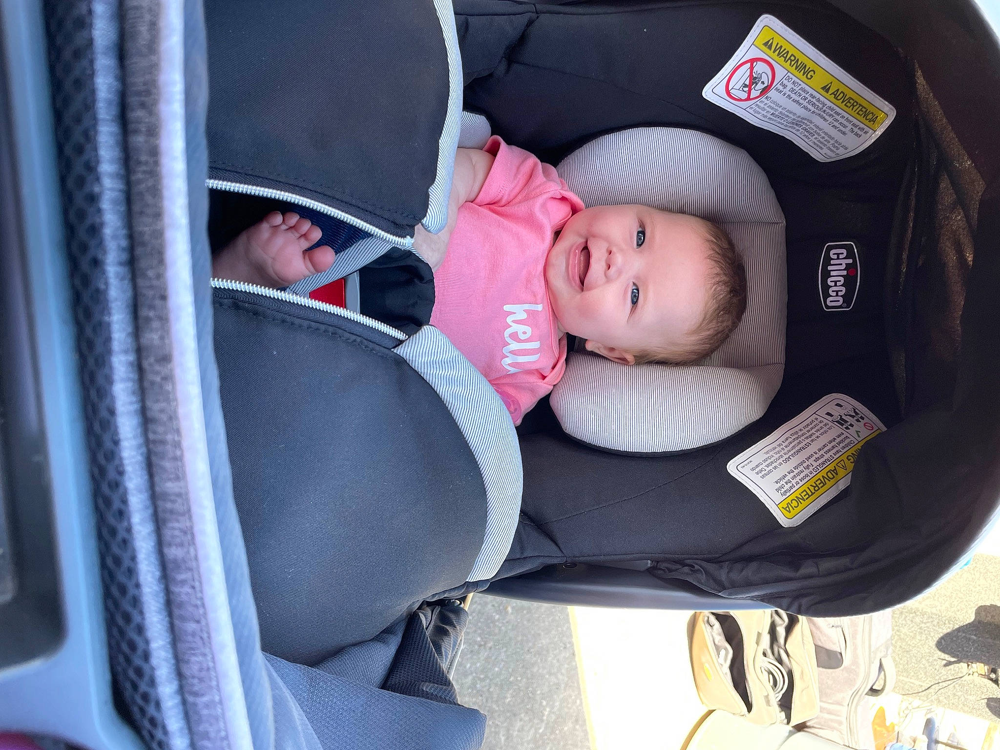 Kennedy is registered to the contest to win money with this photo: auto_part, baby, baby_carriage, baby_in_car_seat, baby_products, baby_safety, baby_toddler_clothing, car_seat, car_seat_cover, carmine, child, comfort, family_car, hat, helmet, joy, person, product, sitting, steering_wheel