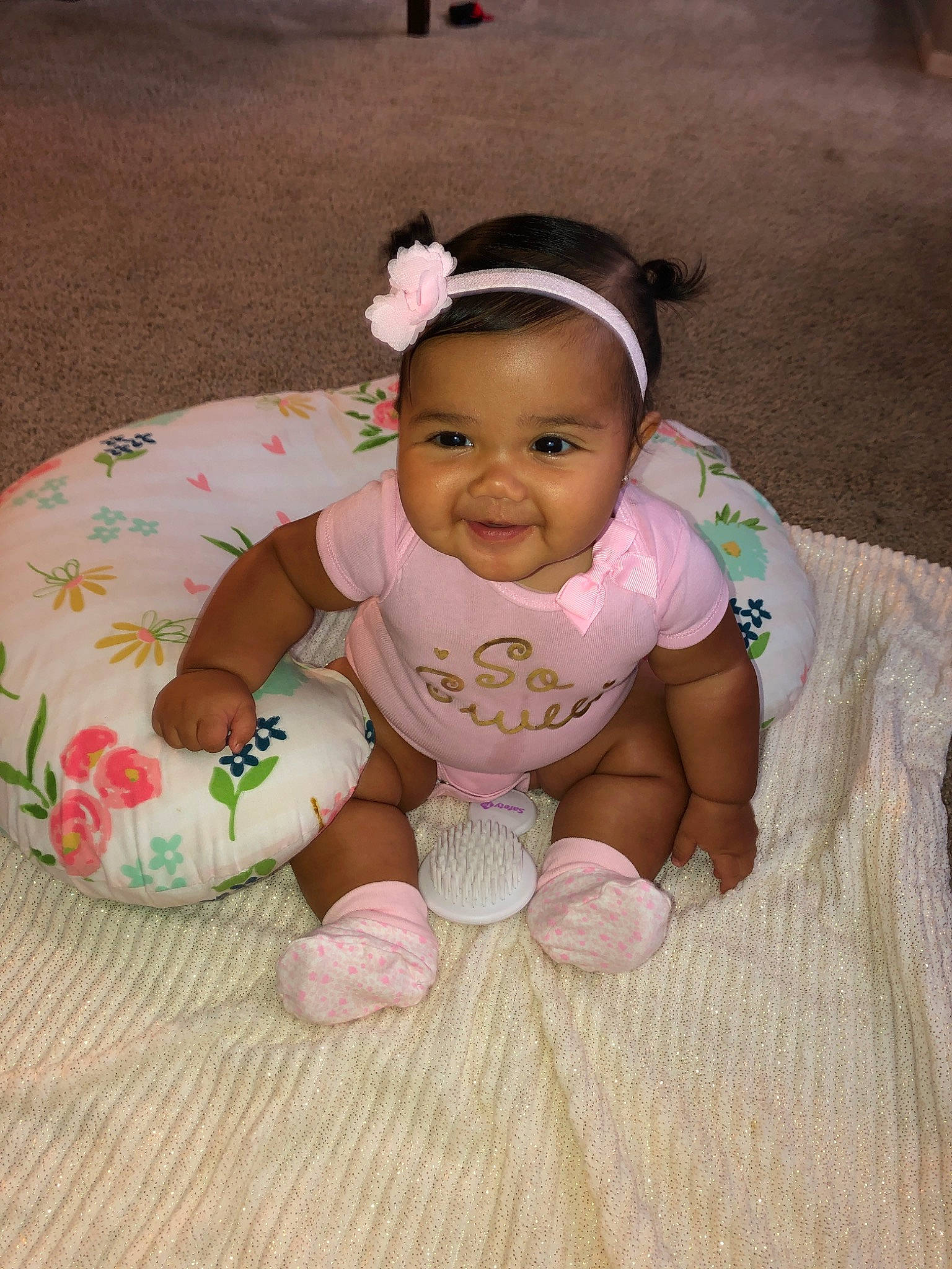 Ellia is registered to the contest to win money with this photo: baby, baby_toddler_clothing, cheek, child, hair_accessory, hand, head, joy, person, pink, play, product, sitting, skin, smile, toddler