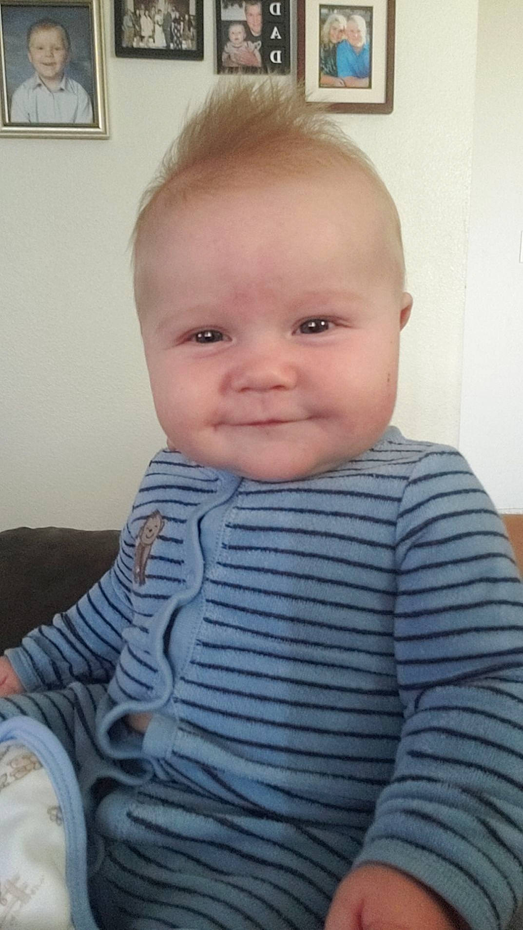 Greyson is registered to the contest to win money with this photo: baby, baby_toddler_clothing, blurred, cheek, child, comfort, electric_blue, eyelash, hair, human_body, iris, joy, lip, nose, pattern, person, picture_frame, sitting, skin, sleeve