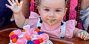 Oakley joined the competition — help win amazing prizes! baby, birthday_cake, blue_eyes, cake, celebration, child, colorful, face, festive, first_birthday, food, frosting, hand, high_chair, messy, party_hat, pink, smile, wooden_chair