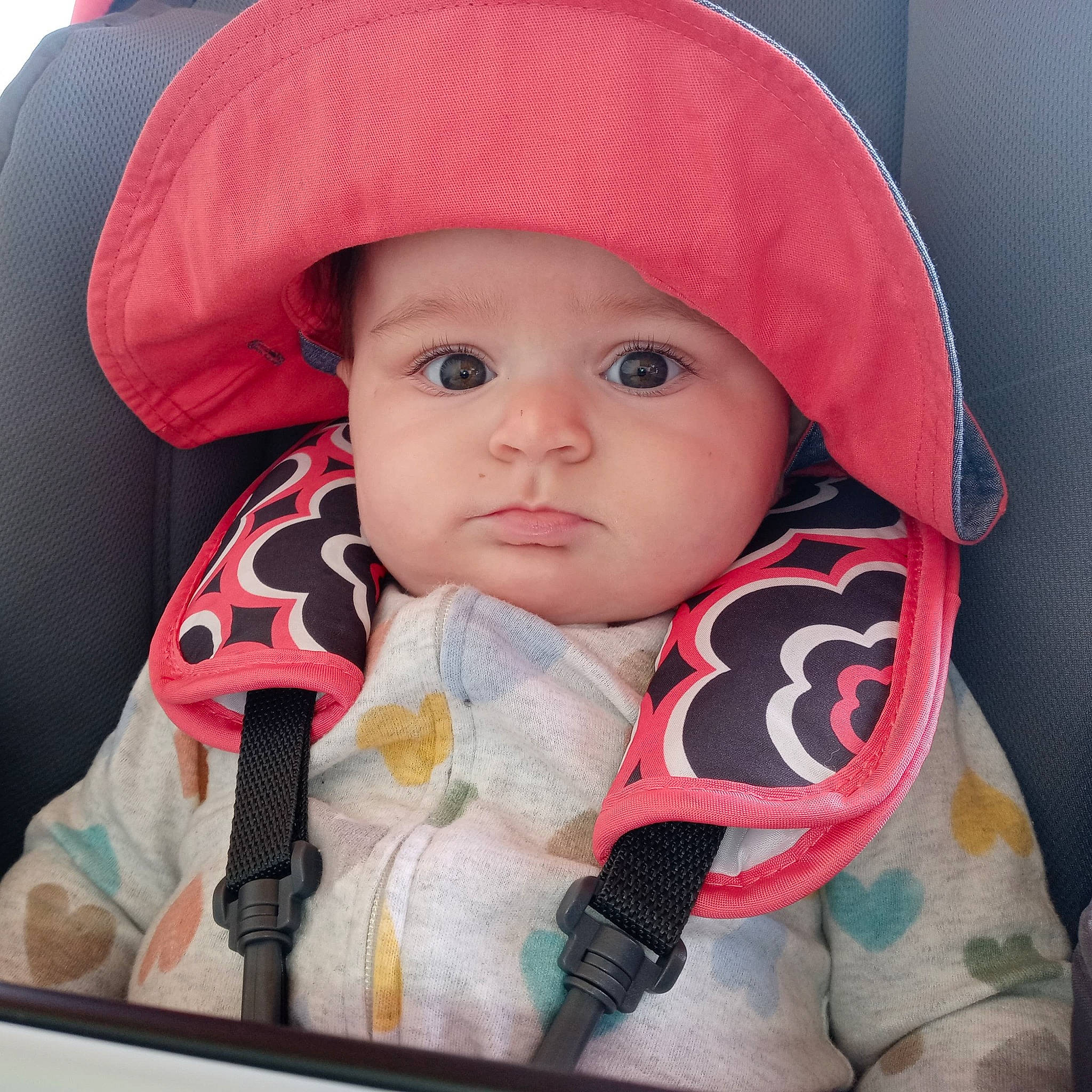 Winry joined the competition — help win amazing prizes! baby, baby_carriage, baby_in_car_seat, baby_safety, baby_toddler_clothing, cap, cheek, child, chin, comfort, eyelash, face, headwear, lip, nose, outerwear, person, pink, product, skin