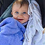 baby, infant, blue_eyes, smile, blanket, purple_blanket, muslin_blanket, white_cloth, car_seat, tuft_of_hair, rosy_cheeks, long_eyelashes, portrait, closeup, cozy, happy, adorable, soft_texture, daylight, content