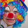 Aurora joined the competition — help win amazing prizes! bow_tie, child, closeup, clown, colorful, costume, curly_hair, face_paint, fun, happy, hat, makeup, party, person, plaid, portrait, rainbow_colors, red_nose, smile, wig