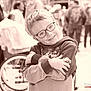 child, boy, glasses, smile, hoodie, paw_patrol, arms_crossed, wheelchair, people, outdoor, crowd, sepia, portrait, happy, casual_clothing, young, glasses_frame, kid, background_blur, daytime