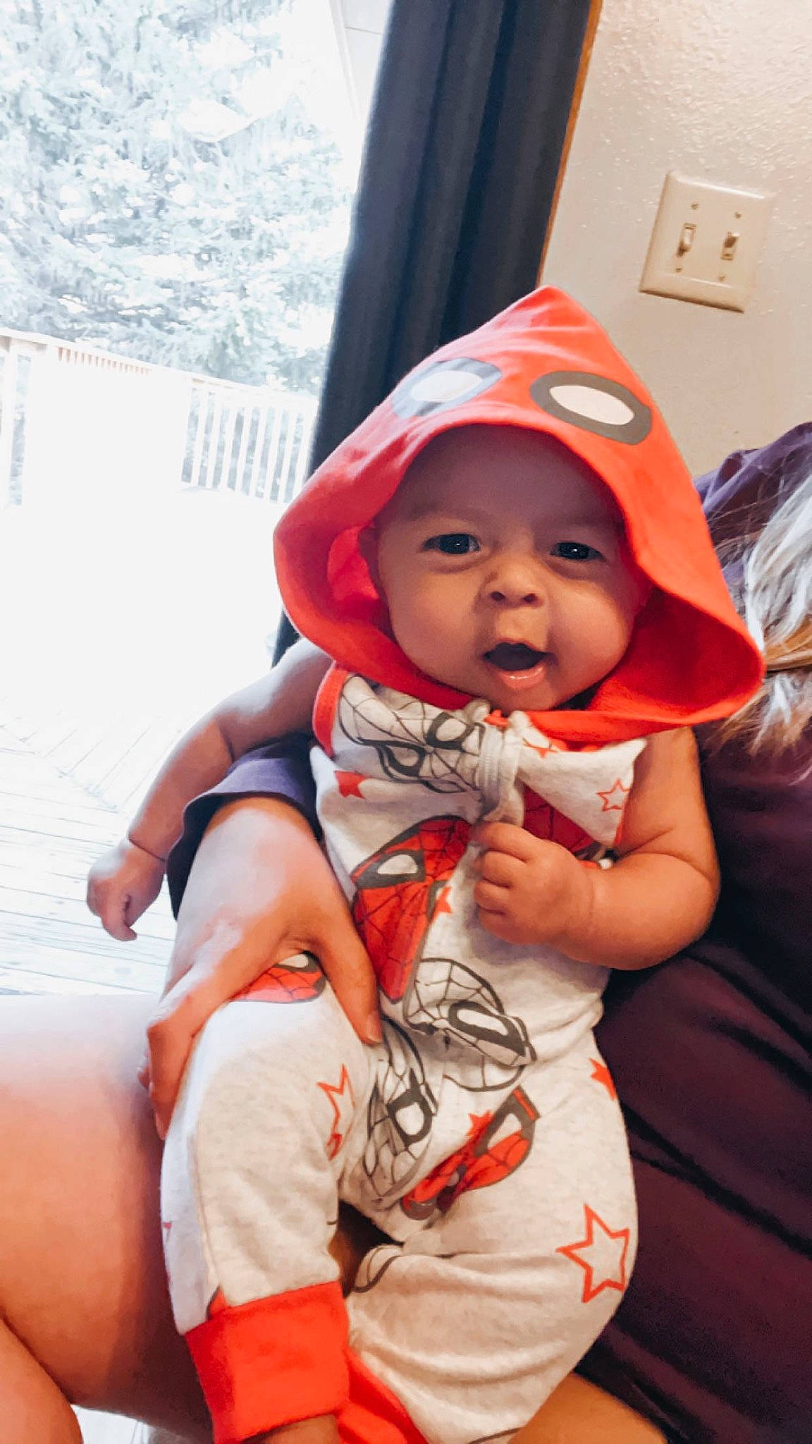 Kanoa is registered to the contest to win money with this photo: baby, baby_products, baby_toddler_clothing, cap, carmine, child, comfort, costume, eye, face, fun, happy, headgear, headwear, light_switch, mouth, person, sitting, skin, sleeve