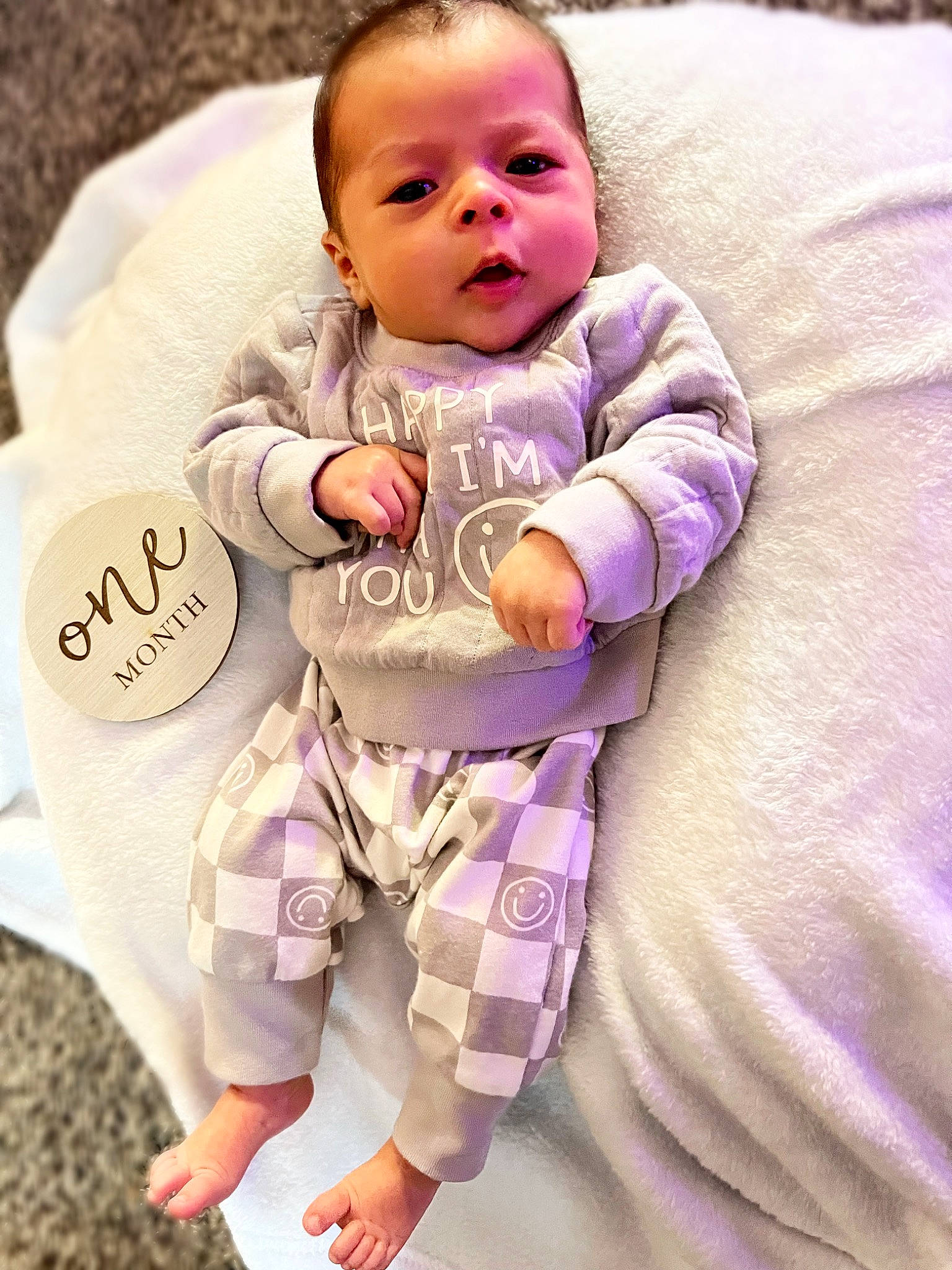 Kanoa is registered to the contest to win money with this photo: baby, baby_toddler_clothing, cheek, comfort, eye, face, hairstyle, happy, head, human_body, iris, person, pink, product, purple, skin, sleeve, smile, t_shirt, textile