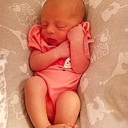Adaline is registered to the contest to win money with this photo: newborn, baby, sleeping, infant, pink_clothing, cushion, patterned_bedding, peaceful, small_feet, cute, sleep, infant_pose, soft_lighting, resting, human, portrait, indoors, baby_girl, toddler, cozy