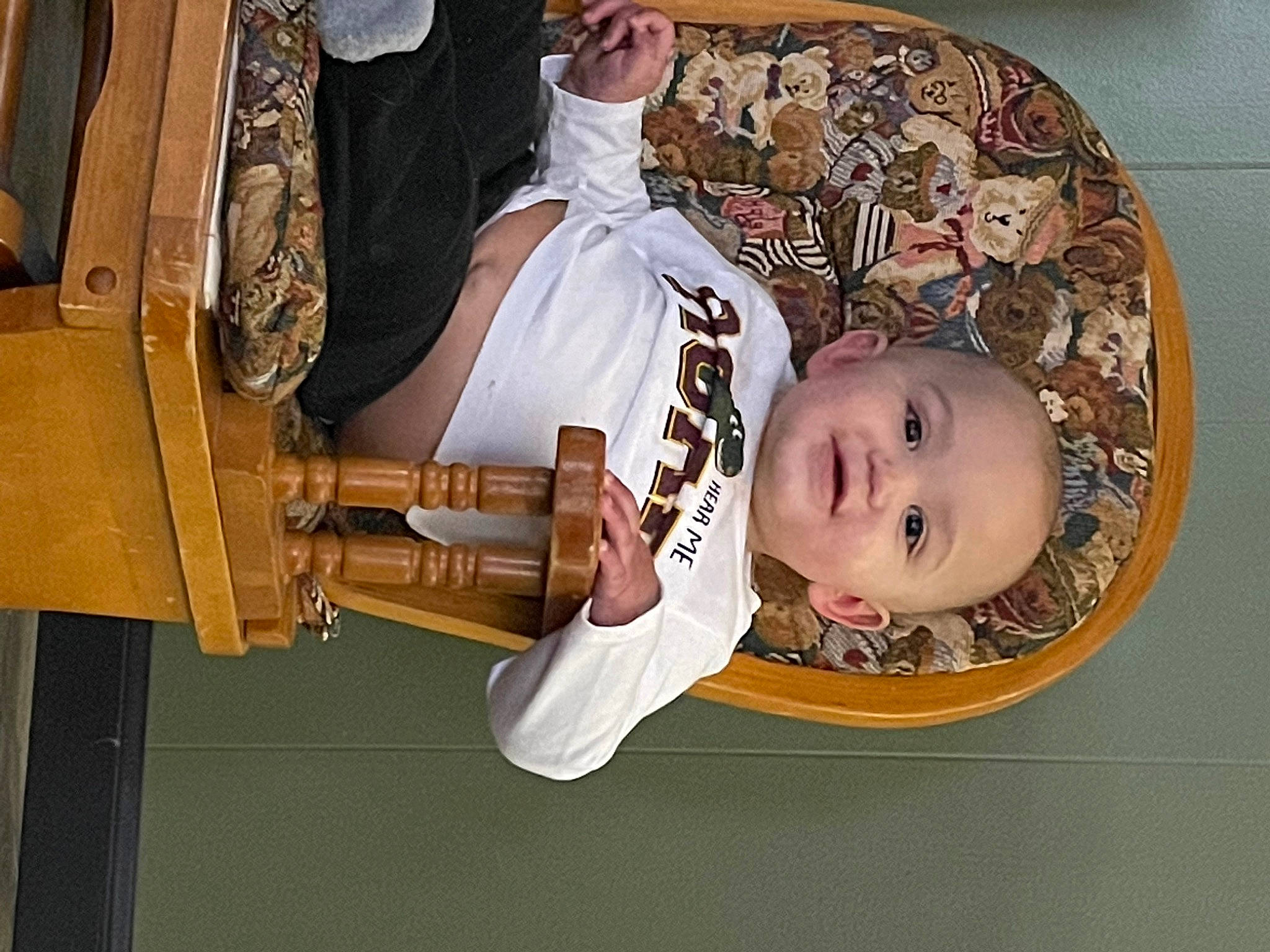 Jakai is registered to the contest to win money with this photo: baby, child, hat, music, musical_instrument, pattern, person, plucked_string_instruments, room, toddler, wood