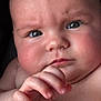 baby, blue_eyes, chubby, close_up, curious, cute, expression, face, fingers, hand, human, indoors, infant, nude, person, portrait, skin, skin_texture, soft_light, young_child