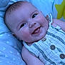 Valerie joined the competition — help win amazing prizes! baby, blanket, buttons, cheeks, clothing, cute, eyes, face, happy, infant, laying, pattern, person, portrait, skin, smiling, soft, star, striped, tongue