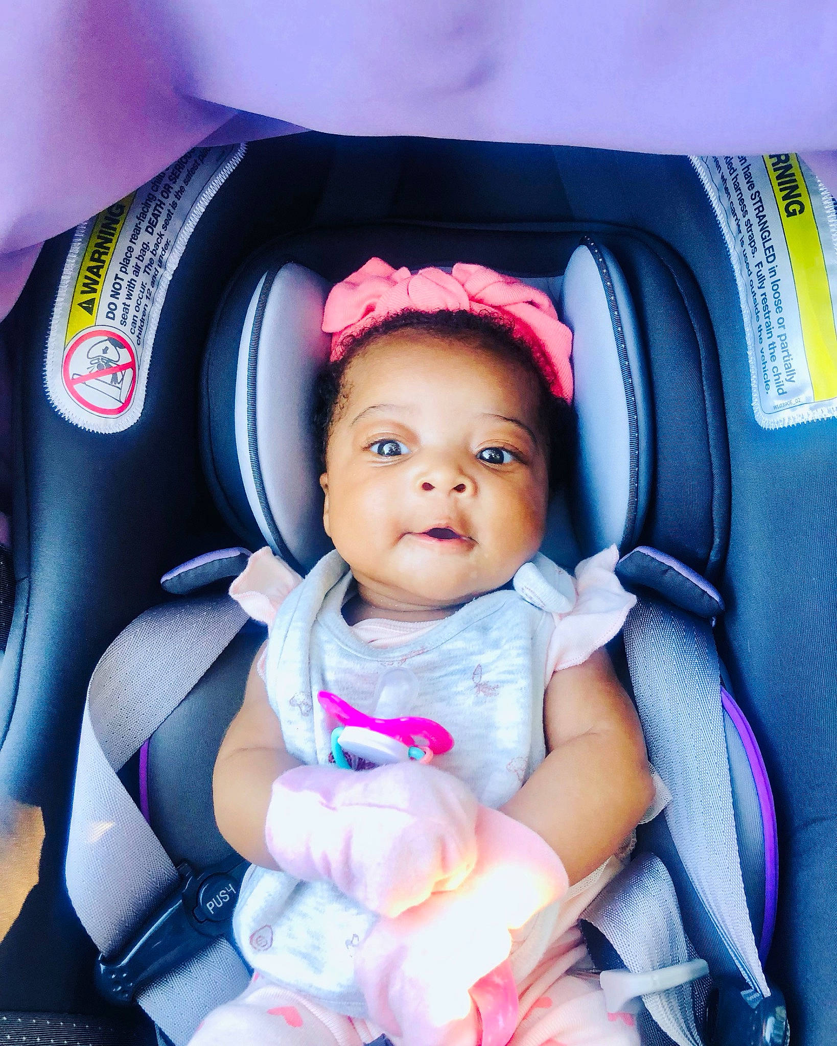 Angelica is registered to the contest to win money with this photo: auto_part, baby, baby_carriage, baby_in_car_seat, baby_products, baby_safety, baby_toddler_clothing, car_seat, child, comfort, electric_blue, eye, finger, fun, head, person, seat_belt, smile, steering_wheel, thumb