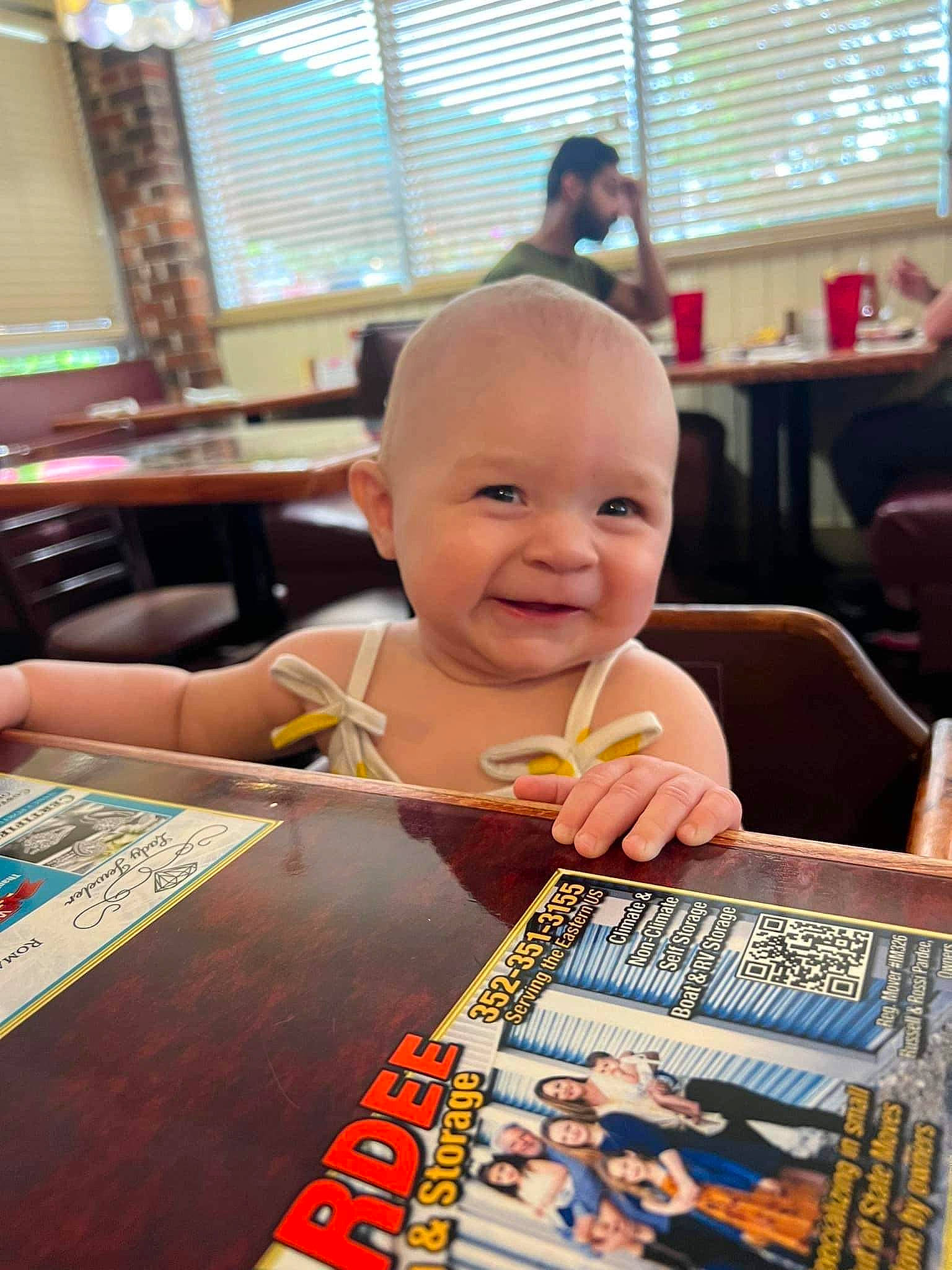 Ellie is registered to the contest to win money with this photo: art, baby, blurred, chair, child, flooring, fun, happy, indoor_games_and_sports, joy, leisure, person, play, publication, recreation, room, smile, table, toddler, toy