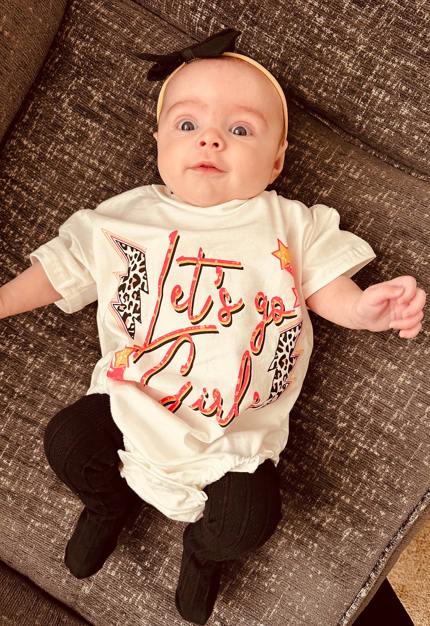 Remington joined the competition — help win amazing prizes! baby, baby_products, baby_toddler_clothing, carmine, cheek, child, collar, eye, flooring, happy, linens, long_sleeved_t_shirt, outerwear, pattern, person, sitting, sleeve, t_shirt, toddler, top