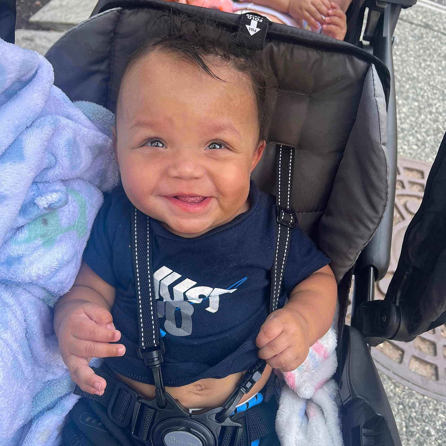 Javon Jr is registered to the contest to win money with this photo: accessories, baby, bodypart, clothing, coat, face, finger, hand, happy, head, jacket, pants, person, photography, portrait, smile, strap, stroller, sunglasses, t_shirt
