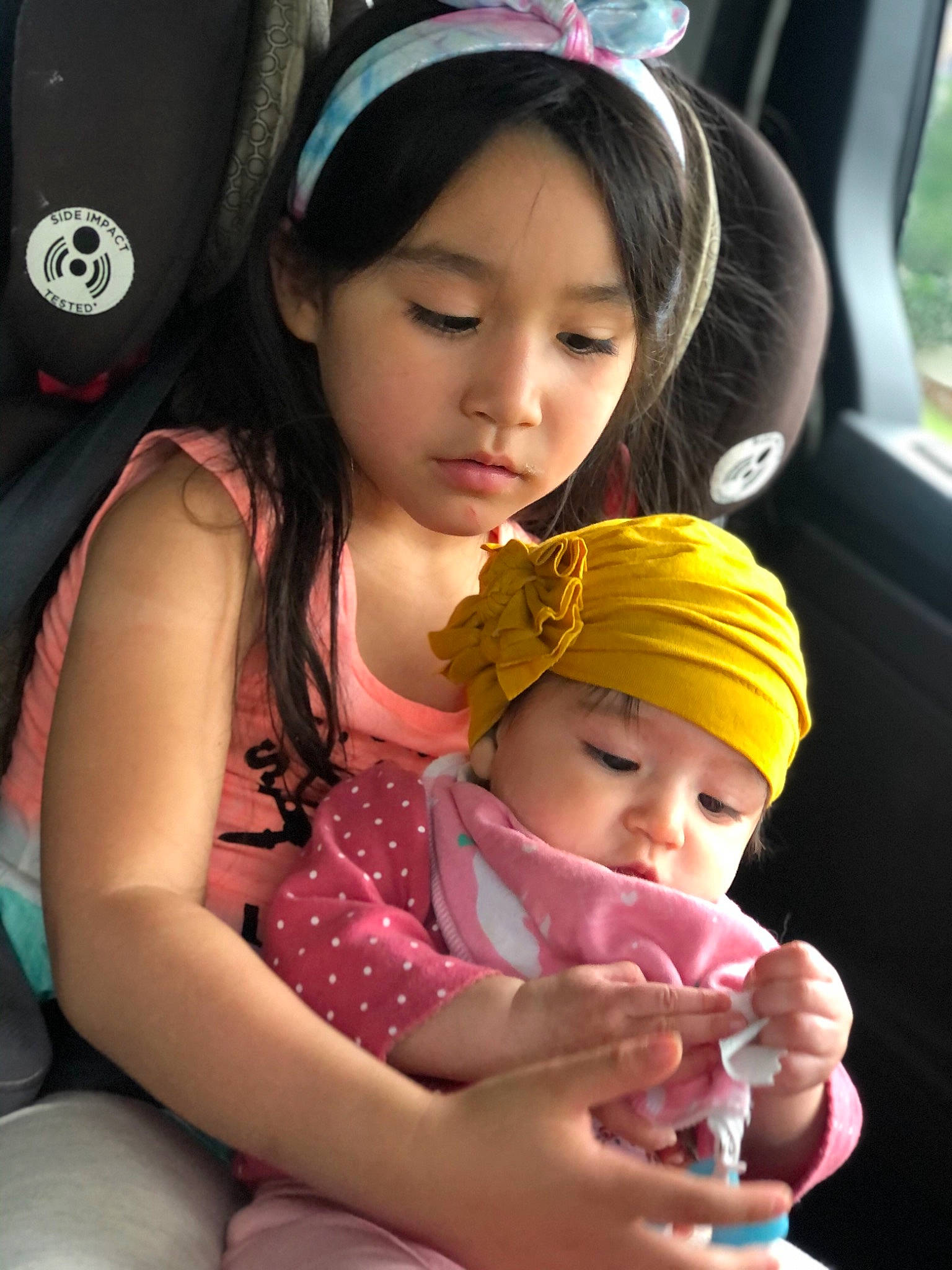 Tesi is registered to the contest to win money with this photo: cap, child, cool, face, facial_expression, finger, fun, hairstyle, hand, happy, headgear, headwear, human, leisure, lip, organ, person, photograph, pink, product