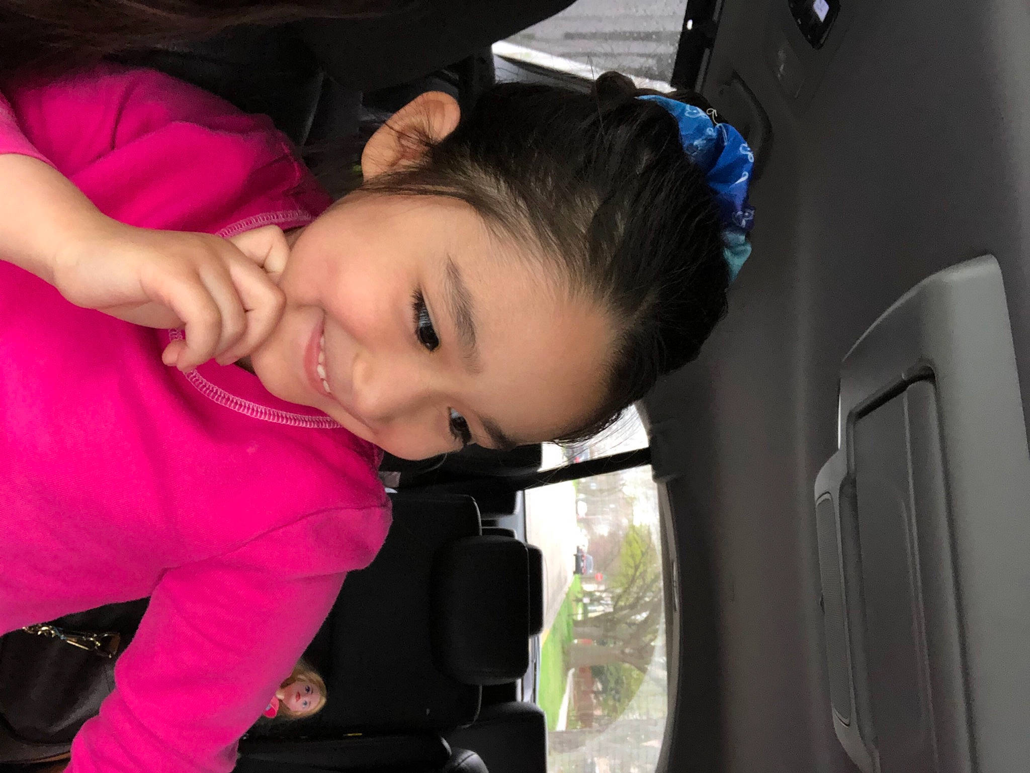 Tesi joined the competition — help win amazing prizes! auto_part, black_hair, child, eyelash, flash_photography, fun, happy, joy, leisure, magenta, nose, person, shoulder, sitting, skin, smile, toddler, vacation, vehicle_door