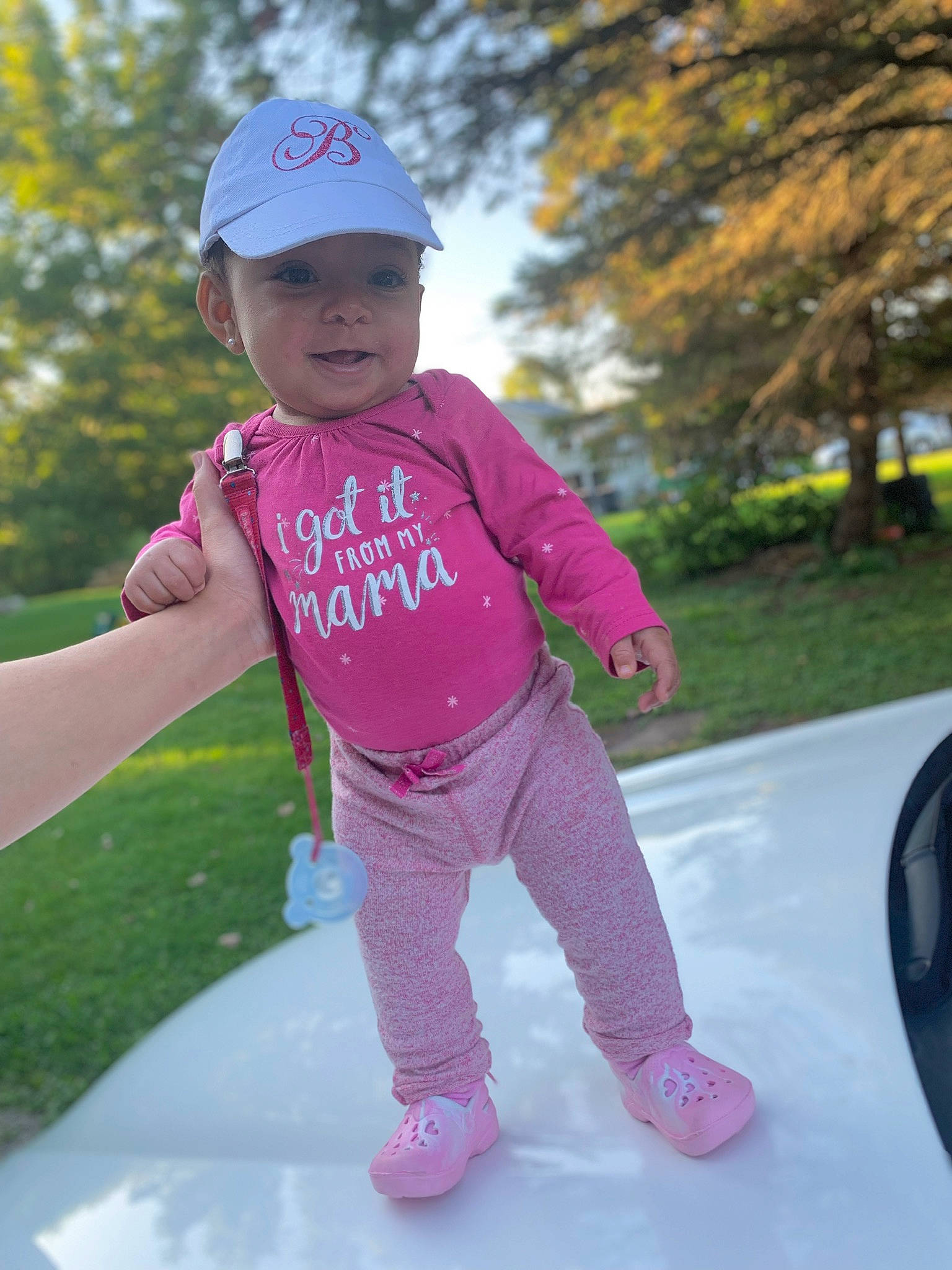 Brentlye Hunter is registered to the contest to win money with this photo: baby, child, cool, fun, headgear, headwear, leisure, magenta, outerwear, person, photography, pink, plant, play, recreation, sleeve, smile, t_shirt, toddler, tree