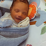 Zyair is registered to the contest to win money with this photo: animal_print, baby, bedtime, blanket, butterfly, child, cozy, cute, face, infant, mittens, newborn, peaceful, playmat, portrait, sleeping, smile, soft, toy, wrapped