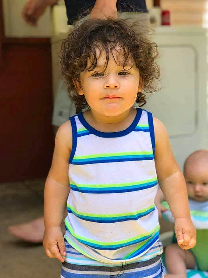 Auston is registered to the contest to win money with this photo: arm, baby, blurred, cheek, child, leisure, neck, person, play, smile, t_shirt, toddler