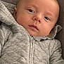 James Bleu is registered to the contest to win money with this photo: baby, infant, hoodie, gray_clothing, blanket, blue_blanket, green_blanket, face, eyes, head, baby_seat, patterned_background, child, cute, portrait, snuggled, soft_texture, indoor, cozy, young_child