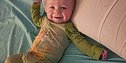 Maximo joined the competition — help win amazing prizes! baby, babylaughing, bed, bedroom, clothing, crib, cushion, face, furniture, glove, happy, head, homedecor, infantbed, pants, person, photography, pillow, portrait, smile